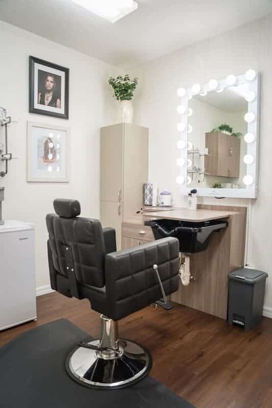 Hair and Makeup salon studio with a chair and mirror